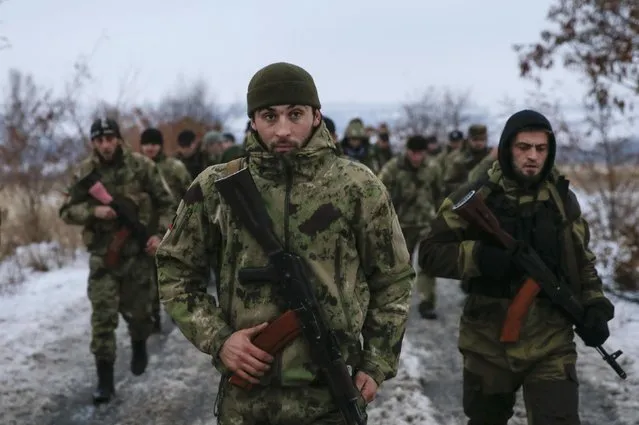 Pro-Russian separatists from the Chechen “Death” battalion walk during a training exercise in the territory controlled by the self-proclaimed Donetsk People's Republic, eastern Ukraine, December 8, 2014. (Photo by Maxim Shemetov/Reuters)