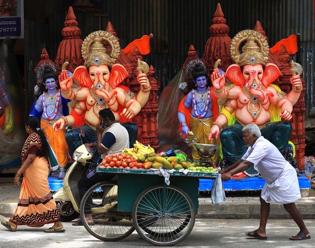 Idols of elephant-headed Hindu God Ganesha on display ahead of Ganesha Chaturthi festival, kept at a roadside workshop in Bangalore, India, 22 August 2025. The Ganesha Festival, also known as Ganesha Chaturthi, celebrates the birthday of the Hindu god Lord Ganesha. Observed in the Hindu calendar month of Bhadrapada, this year's festival runs from 27 August to 05 September. (Photo by Jagadeesh N.V./EPA)