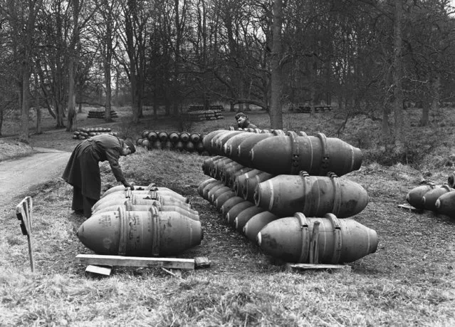 Guns, tanks, bomb, ambulances, half tracks, lorries and vehicles of every description now are being got ready for the second front at a U.S. service of supply Ordnance depot somewhere in England, on March 3, 1944. Stacks of 1000 pounders at  Invasion city. (Photo by AP Photo)