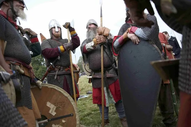 Re-enactors dress in historical costume as part of the Battle of Hastings anniversary commemoration events in Battle, Britain October 15, 2016. (Photo by Neil Hall/Reuters)