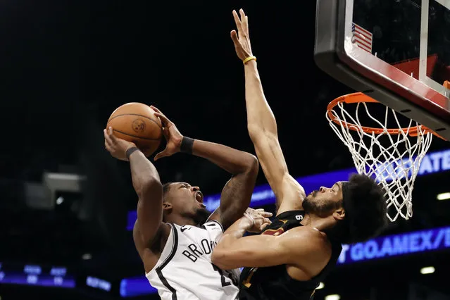 Dorian Finney-Smith #28 of the Brooklyn Nets goes to the basket as Jarrett Allen #31 of the Cleveland Cavaliers defends during the first half at Barclays Center on March 23, 2023 in the Brooklyn borough of New York City. (Photo by Sarah Stier/Getty Images)