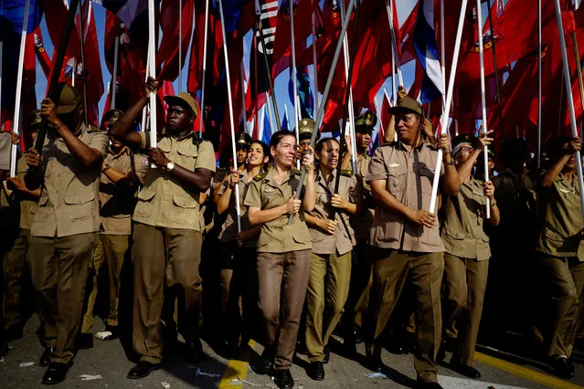 Army soldiers carry flags during the May Day rally in Havana, Cuba on May 1, 2018. (Photo by Alexandre Meneghini/Reuters)