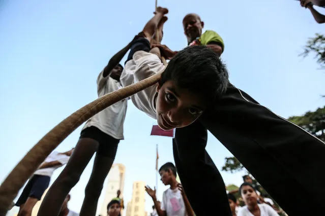 Indian students practice Rope Mallakhamb, during the 44th Samartha Summer Sports Coaching Camp organized by Shree Samarth Vyayam Mandir in Mumbai, India, 20 April 2018. (Photo by Divyakant Solanki/EPA/EFE)