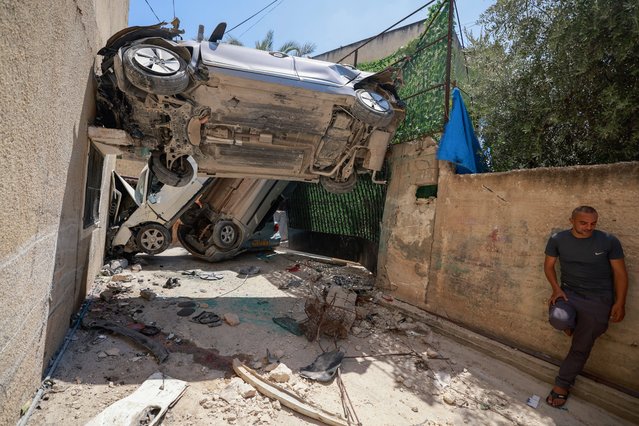 Palestinians inspect the destruction following an Israeli raid in Jenin city in the occupied West Bank on August 6, 2024. Palestinian officials said Israeli forces killed 12 people in three separate raids in the northern West Bank on August 6, as violence in the occupied territory showed no sign of abating. (Photo by Jaafar Ashtiyeh/AFP Photo)