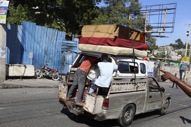 Residents flee their home escaping gang violence in the Solino neighborhood of Port-au-Prince, Haiti, Saturday, October 26, 2024. (Photo by Odelyn Joseph/AP Photo)