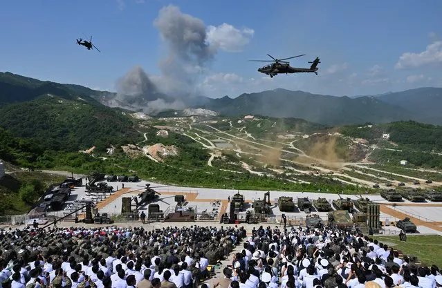 Visitors watch a South Korea-US joint military drill at Seungjin Fire Training Field in Pocheon on June 15, 2023. (Photo by Jung Yeon-Je/Pool via AFP Photo)