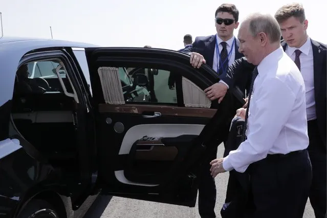 Russia' s President Vladimir Putin (front) gets into his limousine at Helsinki Airport in Helsinki, Finland on July 16, 2018. (Photo by Mikhail Metzel/TASS)