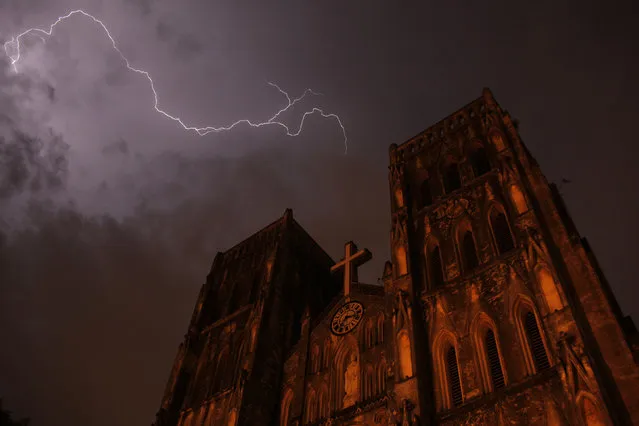 Lighting strikes over Saint Joseph cathedral during a storm in Hanoi, July 2012. (Photo by Carlos Barria/Reuters)