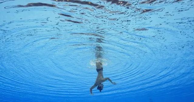 Eduard Kim, of Kazakhstan, competes in the men's solo technical of artistic swimming at the World Swimming Championships in Fukuoka, Japan, Friday, July 14, 2023. (Photo by David J. Phillip/AP Photo)
