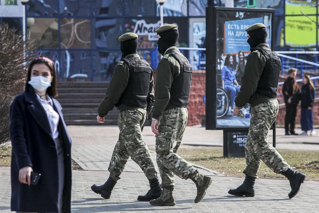 Police patrol a street to prevent an opposition action to protest the official presidential election results in Minsk, Belarus, Saturday, March 27, 2021. Belarusian opposition has urged people to protest against repressions in the country and Lukashenko's regime. (Photo by BelaPan via AP Photo)
