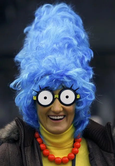 A woman dressed in a costume of Marge Simpson poses at “Weiberfastnacht” (Women's Carnival) in Cologne February 12, 2015. (Photo by Ina Fassbender/Reuters)