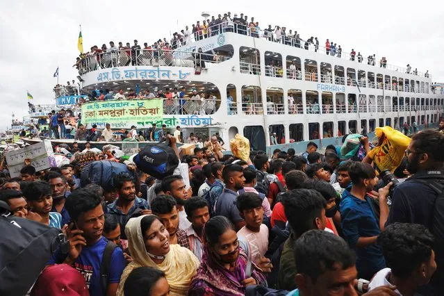 People take their seats on the deck of an overcrowded ferry as they leave the capital city to celebrate Eid-al Adha with their families, in Dhaka, Bangladesh on June 27, 2023. (Photo by Mohammad Ponir Hossain/Reuters)