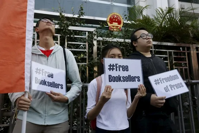 Members of student group Scholarism hold up placards during a protest about the disappearances of booksellers outside China's liaison office in Hong Kong, China January 6, 2016. (Photo by Bobby Yip/Reuters)