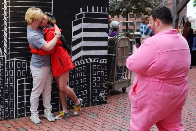Isabella Ferrari and Ben Ra pose for a photograph taken by Jacob deBlecourt at the City of Boston's Pride Kickoff event, celebrating the start of National LGBTQ+ Pride Month, in Boston, Massachusetts, U.S., June 1, 2022. (Photo by Brian Snyder/Reuters)