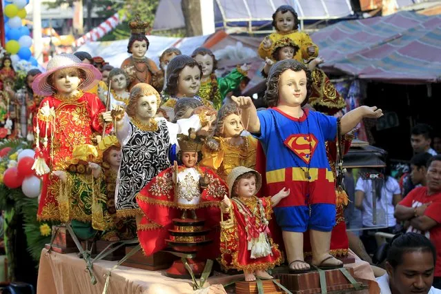 Varying Sto. Nino (infant Jesus) replicas are seen during a procession in Manila January 16, 2016, a day before the annual of the feast day of Sto. Nino on Sunday. (Photo by Romeo Ranoco/Reuters)