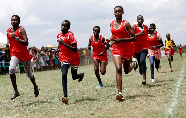 Maasai female athletes compete in the women's 1500-meter race during the 2016 Maasai Olympics at the Sidai Oleng Wildlife Sanctuary, at the base of Mt. Kilimanjaro, near the Kenya-Tanzania border in Kimana, Kajiado, Kenya December 10, 2016. (Photo by Thomas Mukoya/Reuters)