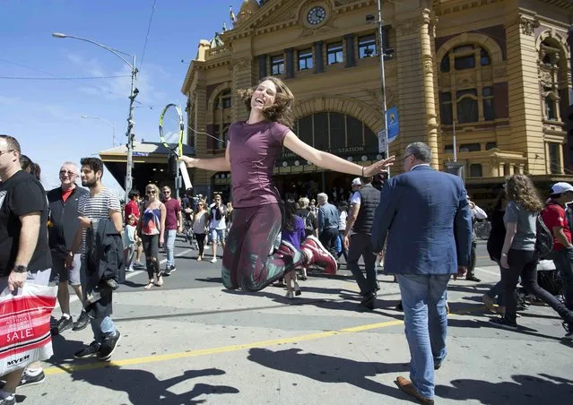 Britain's Johanna Konta jumps as she poses for photos outside Flinders Street Station in Melbourne, as part of a promotional event for the Australian Open tennis tournament in this January 24, 2016 handout photo. (Photo by Fiona Hamilton/Reuters)