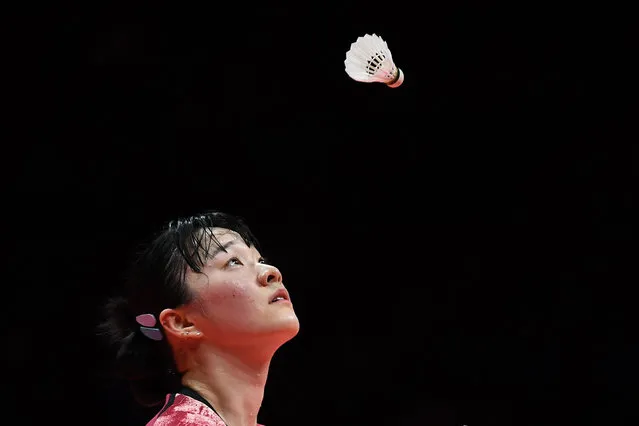 South Korea's Kim Ga Eun looks at the ball during the women’s singles match against Indonesia’s Gregoria Mariska Tunjung at the Badminton World Tour Finals in Hangzhou, in China’s eastern Zhejiang province on December 15, 2023. (Photo by AFP Photo/China Stringer Network)