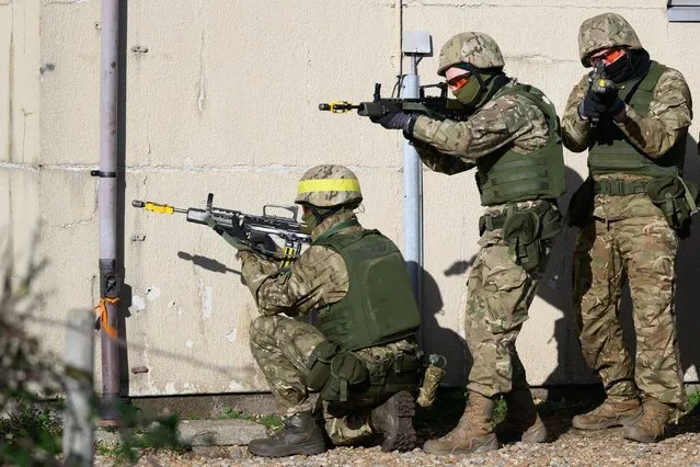 Ukrainian military personnel take part in a training exercise at a facility on November 09, 2022 in southeast England, United Kingdom. The UK has offered to train 19,000 Ukrainian personnel, with several thousand already completing their training and returning to Ukraine since the programme was announced in June, 2022. The scheme has seen over 1,000 UK service personnel from the British Army, Royal Air Force and Royal Marines take part in running the programme. Canada, Denmark, Finland, Sweden, Norway, New Zealand, Latvia and the Netherlands have all joined the training programme. (Photo by Leon Neal/Getty Images)