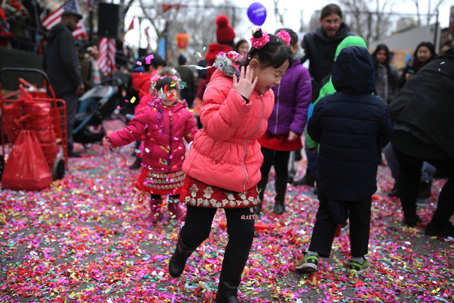 Children play with confetti during a Lunar New Year celebration in Chinatown in Manhattan, New York City, U.S., January 28, 2017. (Photo by Stephen Yang/Reuters)