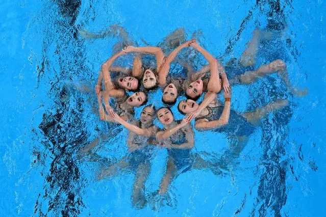 Hao Chang, Ciyue Wang, Wentao Cheng, Binxuan Xiang, Yu Feng, Yanning Xiao, Xiuchen Li and Yayi Zhang of Team China compete in the Mixed Team Free Preliminaries on day seven of the Doha 2024 World Aquatics Championships at Aspire Dome on February 08, 2024 in Doha, Qatar. (Photo by Quinn Rooney/Getty Images)
