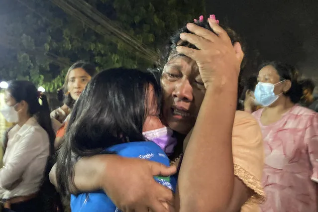 A mother reacts after her daughter, left, was released from Insein Prison in Yangon, Myanmar, Monday, October 18, 2021. Myanmar's government on Monday announced an amnesty for more than 5,600 people arrested for taking part in anti-government activities that protested February's seizure of power by the military. Over 1,000 people were freed from prisons around the country and charges against more than 4,000 others were suspended. (Photo by AP Photo/Stringer)