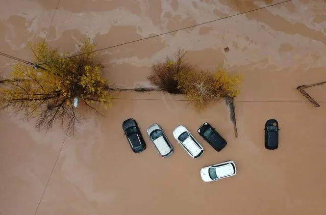 An aerial picture shows a flooded cars in Rajlovac near Sarajevo, Bosnia and Herzegovina November 5, 2021. Picture taken with a drone. (Photo by Dado Ruvic/Reuters)