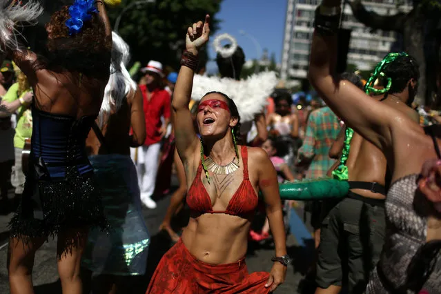 Revellers take part in the annual block party Cordao de Boitata during pre-carnival festivities in Rio Janeiro, Brazil February 19, 2017. (Photo by Pilar Olivares/Reuters)