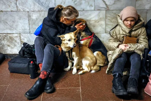 People take shelter inside a metro station during a Russian missile strike in Kyiv, Ukraine, on March 21, 2024. (Photo by Alina Smutko/Reuters)