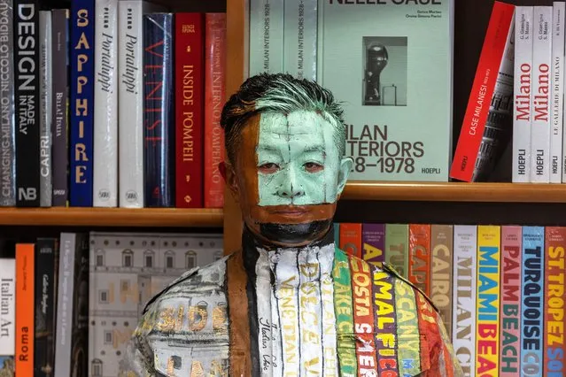 Chinese artist Liu Bolin looks on as he prepares to perform at Libreria Hoepli on March 12, 2024 in Milan, Italy. Represented in Italy by Galleria Gaburro, Liu Bolin has been defined as “the invisible man”, having achieved international fame as the artist who made camouflage his distinctive trait. Remaining still like a living sculpture, Bolin integrates his body with the context behind him – thanks to careful body-painting – and finally has himself photographed. (Photo by Emanuele Cremaschi/Getty Images)