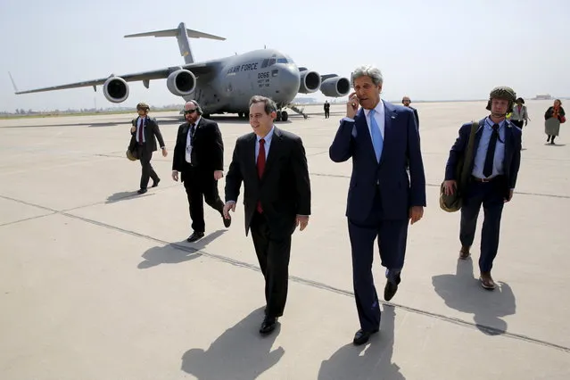 U.S. Ambassador to Iraq Stuart Jones (center L) walks with Secretary of State John Kerry (center R) as he arrives via military transport at Baghdad International Airport in Baghdad on April 8, 2016. (Photo by Jonathan Ernst/Reuters)