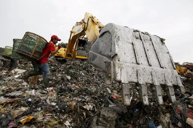 People search through garbage for materials to recycle at Bantar Gebang landfill in Bekasi, West Java province, Indonesia March 2, 2016. (Photo by Darren Whiteside/Reuters)