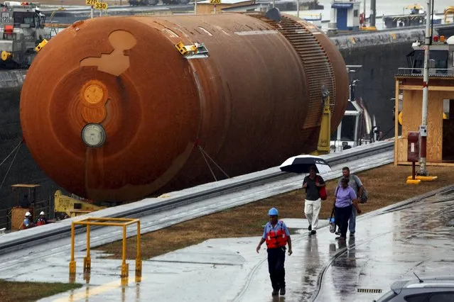 NASA's last space shuttle external tank makes its way through the Miraflores locks of the Panama Canal in Panama City April 26, 2016. The external tank is crossing the Panama Canal on its way to a display venue in California, according to local media. (Photo by Carlos Jasso/Reuters)