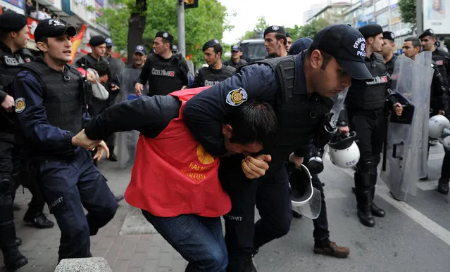 Turkish riot police detain a protester as he and others attempted to defy a ban and march on Taksim Square to celebrate May Day, in Besiktas neighbourhood of Istanbul, Turkey, May 1, 2016. (Photo by Yagiz Karahan/Reuters)