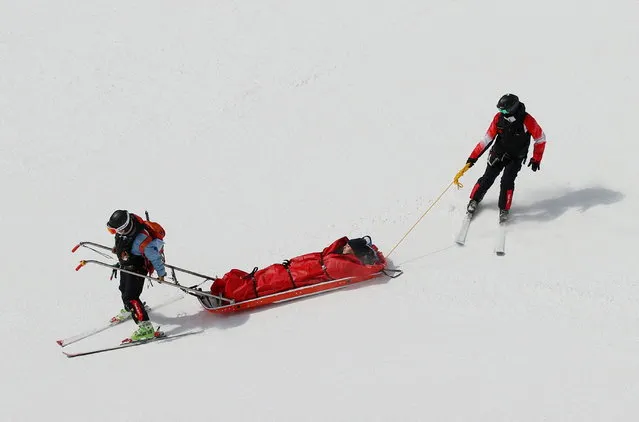 France's Camille Cerutti receives medical assistance after her fall in the womens downhill final during the Beijing 2022 Winter Olympic Games at the Yanqing National Alpine Skiing Centre in Yanqing on February 15, 2022. (Photo by Thomas Peter/Reuters)