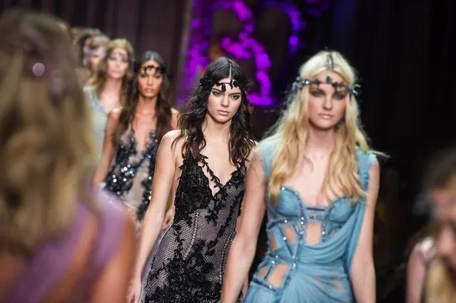 Kendall Jenner, centre, wears a creation for Italian fashion designer Donatella Versace's fall-winter 2015/2016 Haute Couture fashion collection presented in Paris, France, Sunday, July 5, 2015. (Photo by Kamil Zihnioglu/AP Photo)