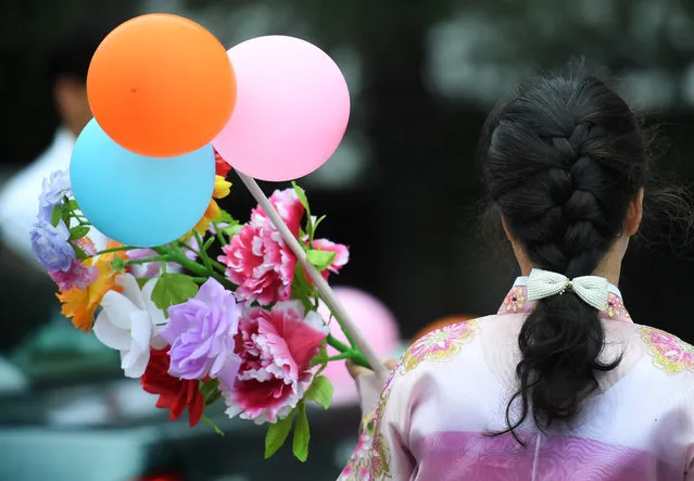 Detail photo of the flowers and balloons that many Korean women will walk with in a parade at Kim Il Sung Square in Pyongyang, North Korea on May 10, 2016. (Photo by Linda Davidson/The Washington Post)