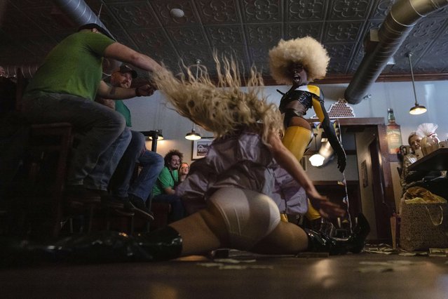 Javon Love, right, performs with Baby Angel, doing the splits, during “Mimosas & Heels Drag Brunch” at the Public House in Norfolk, Va., Sunday, March 5, 2023. The drag bunch was hosted by Harpy Daniels and Javon Love. (Photo by Carolyn Kaster/AP Photo)