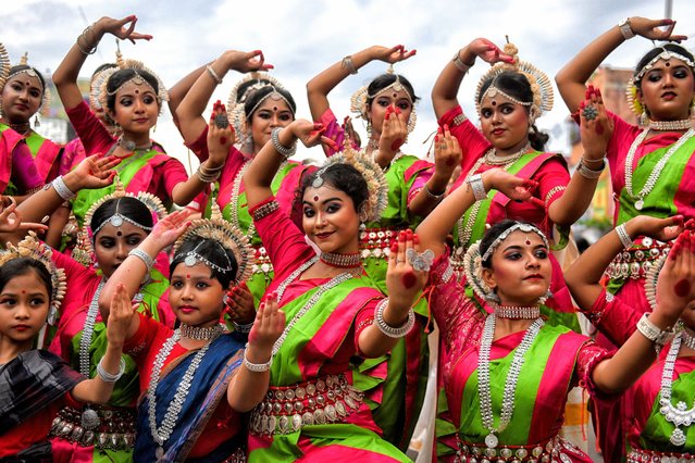 Bharatanatyam (Indian classical dance) dancers pose for photos during the annual Rath Yatra, or chariot festival in Kolkata on July 7, 2024. As per Hindu mythology, the Ratha Yatra dates back some 5,000 years when Hindu god Krishna, along with his older brother Balaram and sister Subhadra, were pulled on a chariot from Kurukshetra to Vrindavana by Krishna's devotees. (Photo by Avishek Das/SOPA Images/Rex Features/Shutterstock)