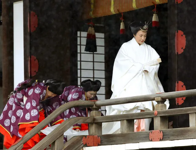 Japan's Empress Masako leaves after praying at “Kashikodokoro”, one of three shrines at the Imperial Palace, in Tokyo, Tuesday, October 22, 2019. Emperor Naruhito and Empress Masako visited three Shinto shrines at the Imperial Palace before Naruhito proclaims himself Japan’s 126th emperor in an enthronement ceremony. (Photo by Kyodo News via AP Photo)