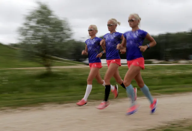 Estonia's olympic team female marathon runners triplets (L-R) Lily, Liina and Leila Luik run during a training session in Tartu, Estonia, May 26, 2016. Leila, Liina and Lily Luik will make Olympics history as the first identical triplets to compete against each other when they cross the start line for the women's marathon in Rio. (Photo by Ints Kalnins/Reuters)