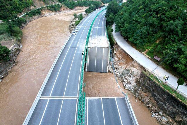 Aerial view of the site of a bridge collapse on July 20, 2024 in Zhashui County, Shangluo City, Shaanxi Province of China. A highway bridge collapse triggered by torrential rains in northwest China's Shaanxi Province has killed 12 people and left 31 missing, according to Xinhua News Agency. (Photo by Zhang Yuan/China News Service/VCG via Getty Images)