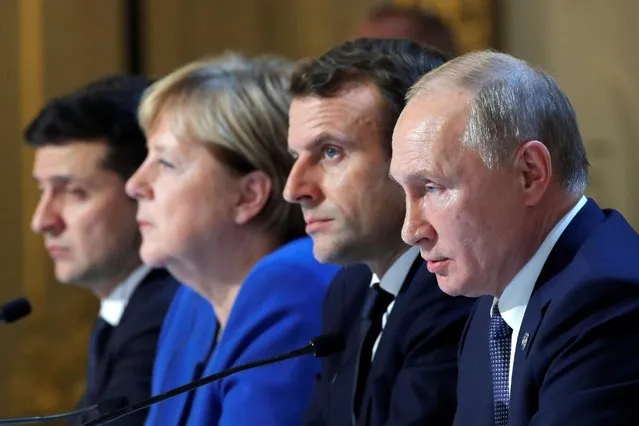 Ukraine's President Volodymyr Zelenskiy, German Chancellor Angela Merkel, French President Emmanuel Macron and Russia's President Vladimir Putin attend a joint news conference after a Normandy-format summit in Paris, France on December 9, 2019. (Photo by Charles Platiau/Reuters/Pool)