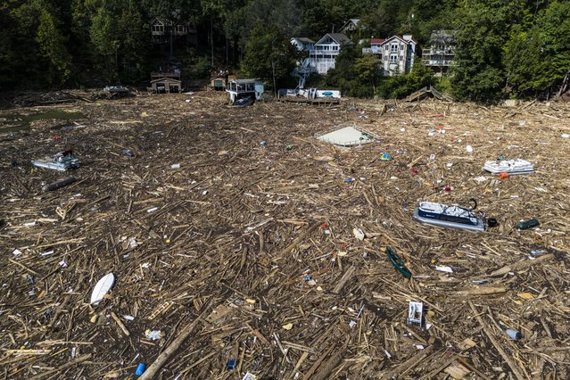 Debris is strewn on the lake in the aftermath of Hurricane Helene, Wednesday, October 2, 2024, in Lake Lure, N.C. (Photo by Mike Stewart/AP Photo)