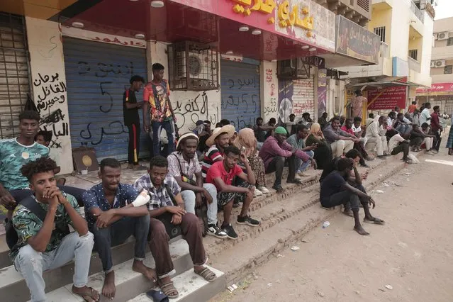 People stage a sit-in demanding a return to civilian rule and to protest the nine people who were killed in anti-military demonstrations last month, in Khartoum, Sudan, Monday, July 4, 2022. (Photo by Marwan Ali/AP Photo)