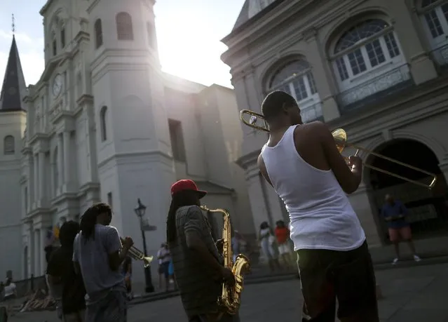 A brass band performs in Jackson Square one day before the ten year anniversary of Hurricane Katrina in New Orleans, Louisiana, August 28, 2015. (Photo by Jonathan Bachman/Reuters)