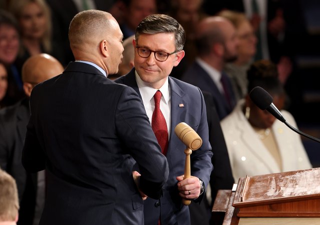 U.S. House Minority Leader Hakeem Jeffries (D-NY) (L) passes the gavel to Speaker of the House Mike Johnson (R-LA) on the first day of the 119th Congress in the House Chamber of the U.S. Capitol Building on January 03, 2025 in Washington, DC. Johnson retained his Speakership in the face of opposition within his own party as the 119th Congress held its first session to vote for a new Speaker of the House. (Photo by Win McNamee/Getty Images)