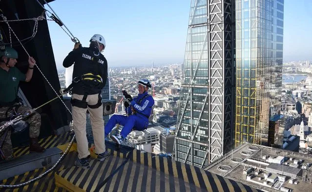 Rupert Atkin, CEO of Talbot Underwriting, abseils down the Gherkin during the Outward Bound Trust's and the Royal Navy & Royal Marine's Charity's most daring stunt: The City Three Peaks Challenge on September 7, 2015 in London, England. (Photo by Stuart C. Wilson/Getty Images for the Outward Bound Trust and the Royal Navy and Royal Marines Charity)