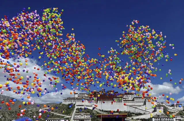 Balloons are released during the celebration event at the Potala Palace marking the 50th anniversary of the founding of the Tibet Autonomous Region, in Lhasa, Tibet Autonomous Region, China, September 8, 2015. (Photo by Reuters/China Daily)