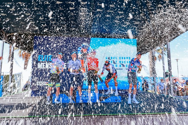 (L-R) Mountain jersey winner Australia's Rudy Porter of ARA Australian Cycling Team, second-placed New Zealand's Aaron Murray Gate of XDS Astana Team, champion Switzerland's Mauro Schmid of Team Jayco AlUla, third-placed New Zealand's Laurence Pithie of Team Red Bull-BORA-Hansgrohe and intermediate sprint jersey winner Australia 's Chris Harper of Team Jayco-Alula celebrate on the podium after the men's elite cycling event of the 2025 Cadel Evans Great Ocean Road Race in Geelong on February 2, 2025. (Photo by Chris Putnam/AFP Photo)